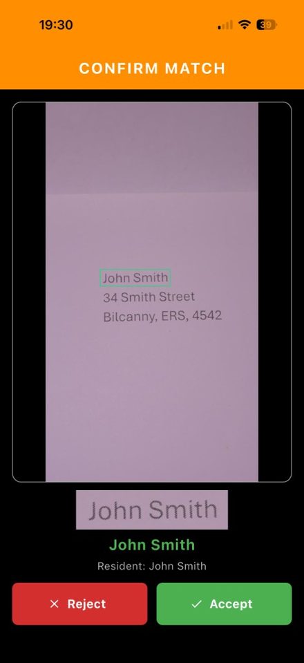 Confirm match screen showing a boxed name on an envelope and Accept or Reject
